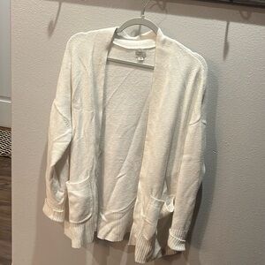 Very cute off white cardigan. Slight stain